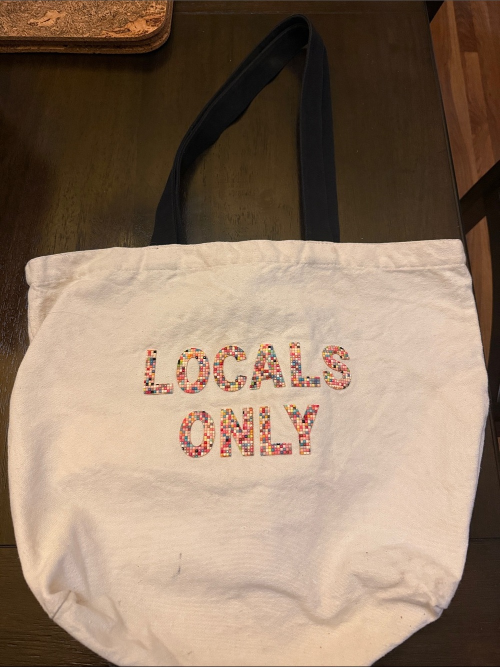 Beaded “Locals Only” tote bag